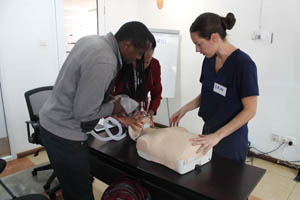 FICCS members teaching the locals how to perform CPR.