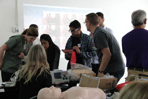 group of people opening supplies for cpr training