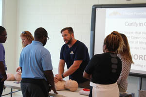 Dr. Fritz teaching cpr in a group