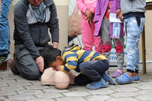 child giving cpr breaths