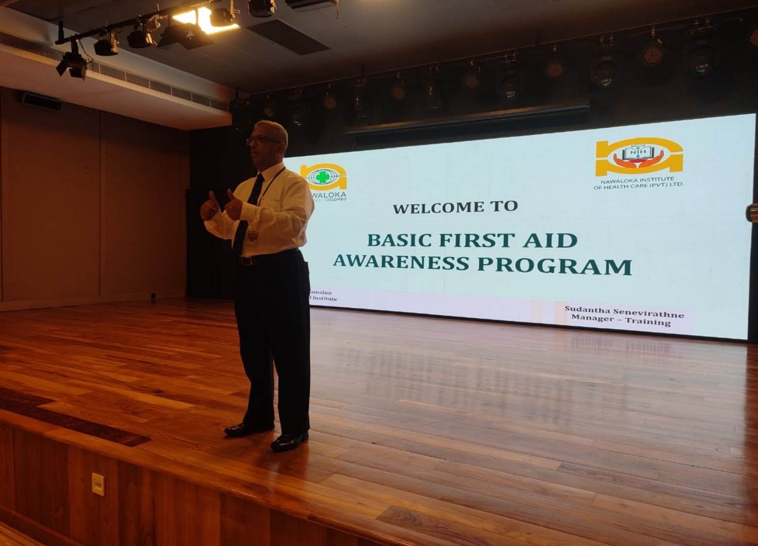 Manager presenting a Basic First Aid Awareness Program, introducing life-saving skills to participants.