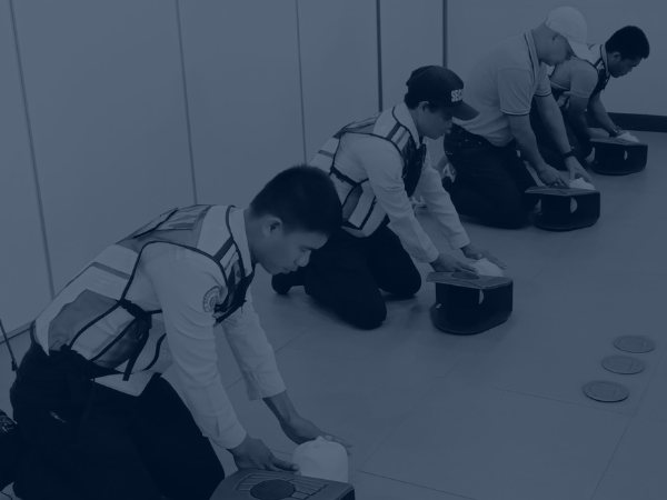 security guards training on cpr using mannequin f